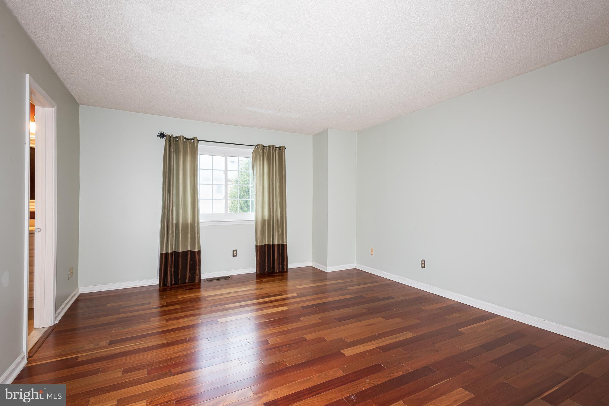 5 Lantern Lane Chesterbrook, PA 19087 - Photo 23 of 30 a view of an empty room with wooden floor and a window