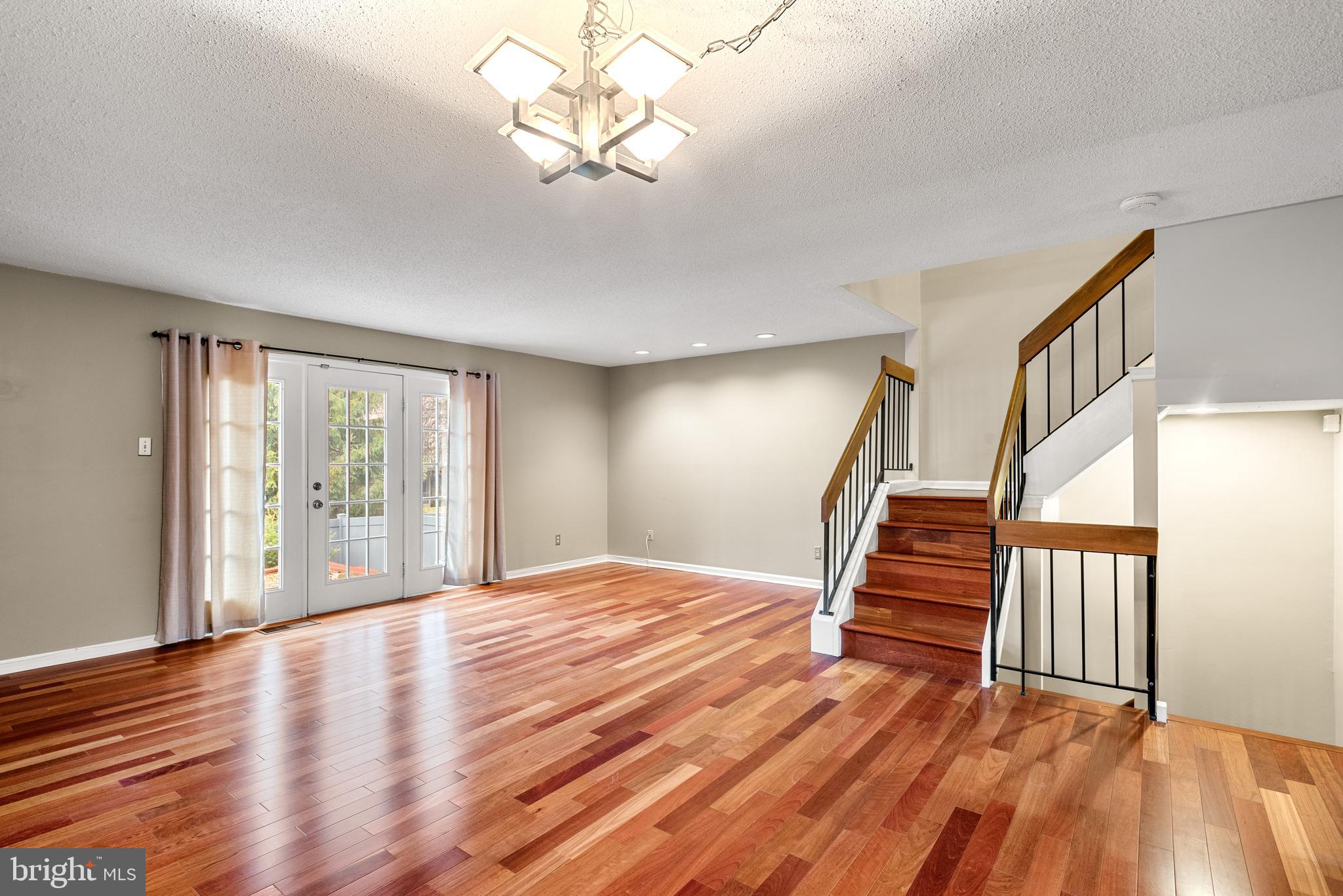 5 Lantern Lane Chesterbrook, PA 19087 - Photo 5 of 30 a view of empty room with wooden floor and fan