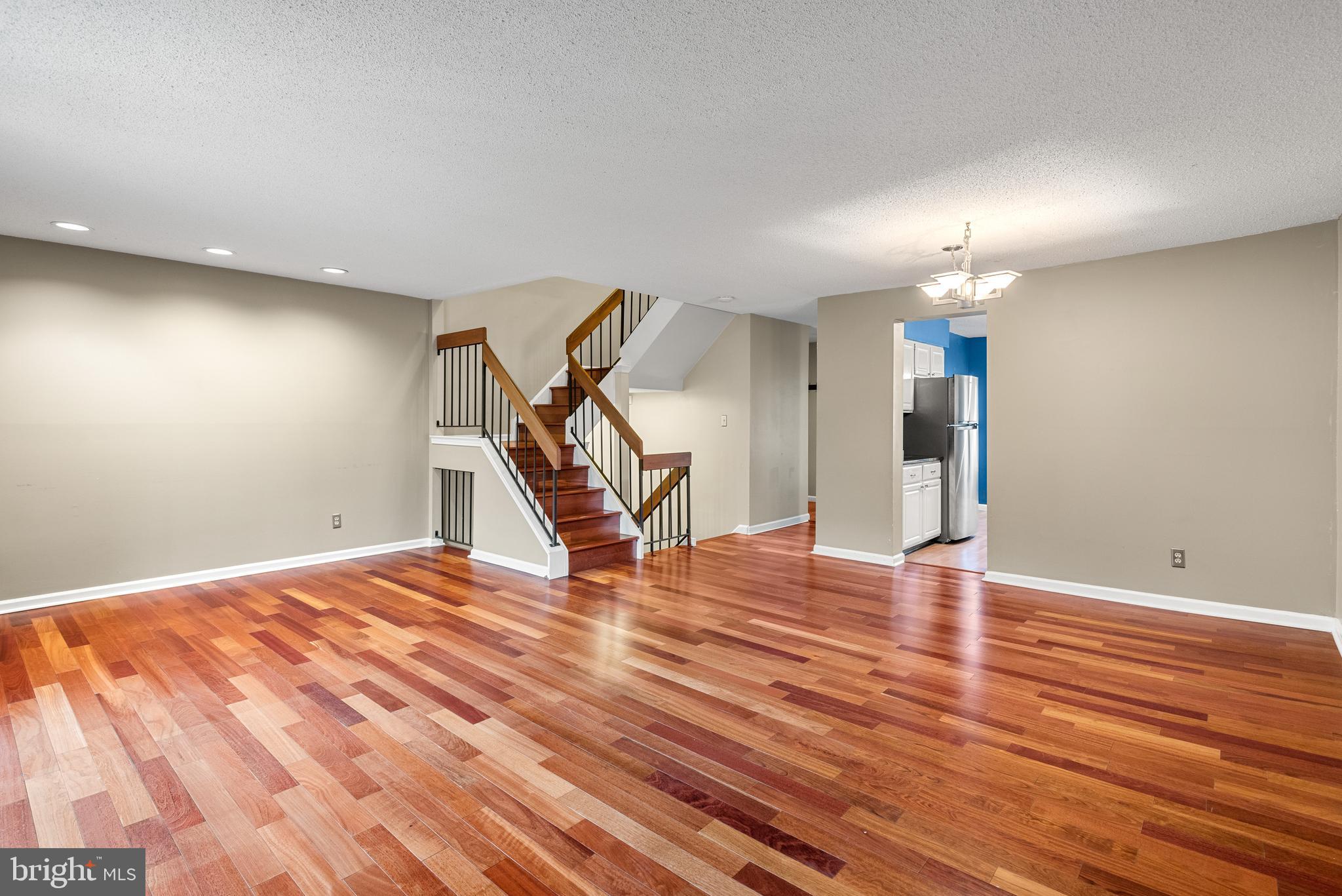 5 Lantern Lane Chesterbrook, PA 19087 - Photo 6 of 30 a view of an empty room with stairs and wooden floor