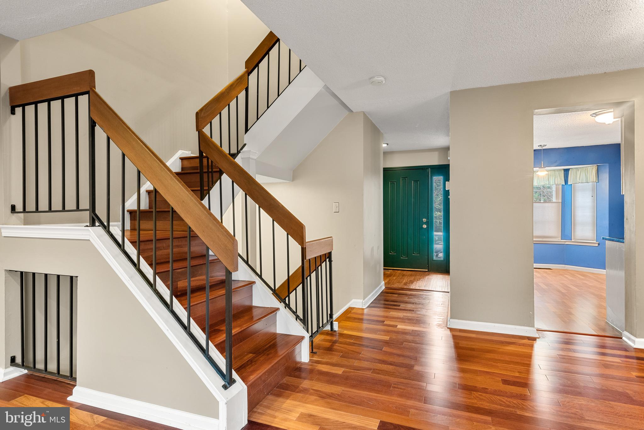 5 Lantern Lane Chesterbrook, PA 19087 - Photo 8 of 30 a view of staircase with lots of frames on wall and wooden floor