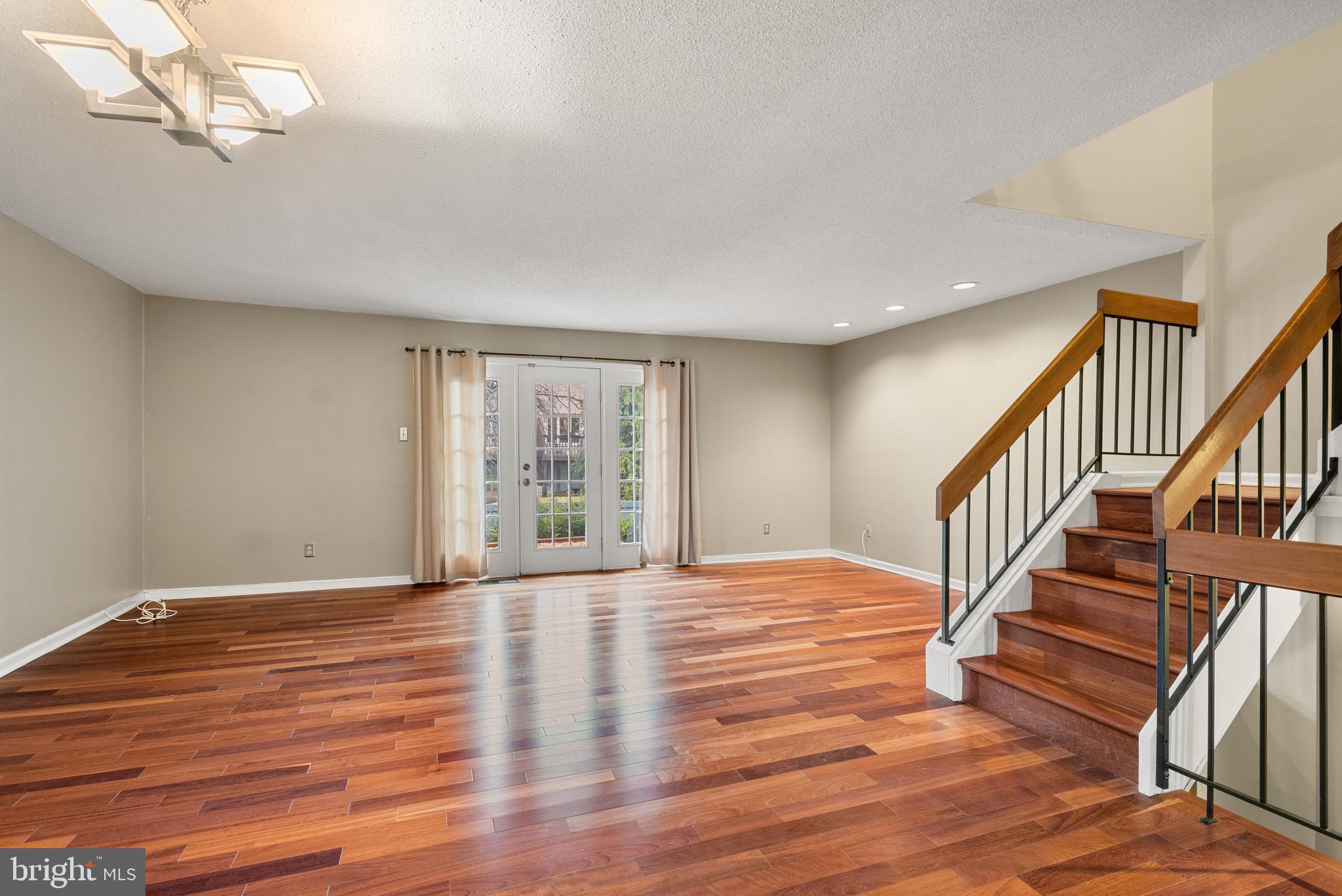 5 Lantern Lane Chesterbrook, PA 19087 - Photo 9 of 30 a view of an empty room with wooden floor and fan