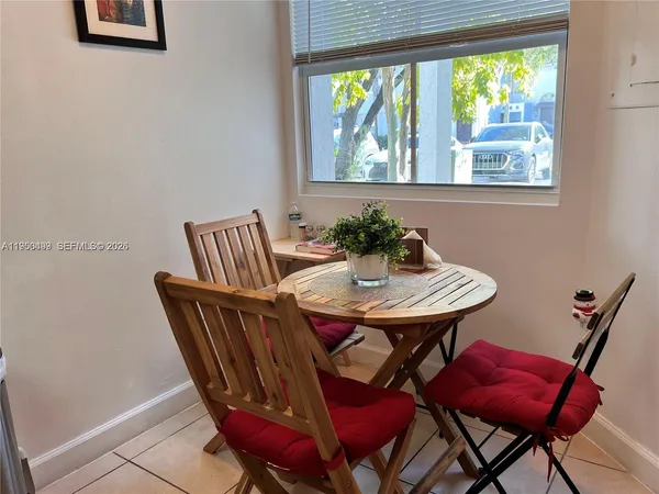 a view of a dining room with furniture window and outside view