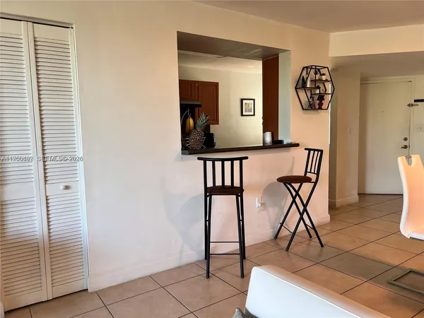 a view of a livingroom with furniture and a window