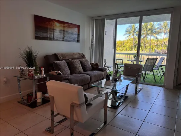 a living room with furniture and a window