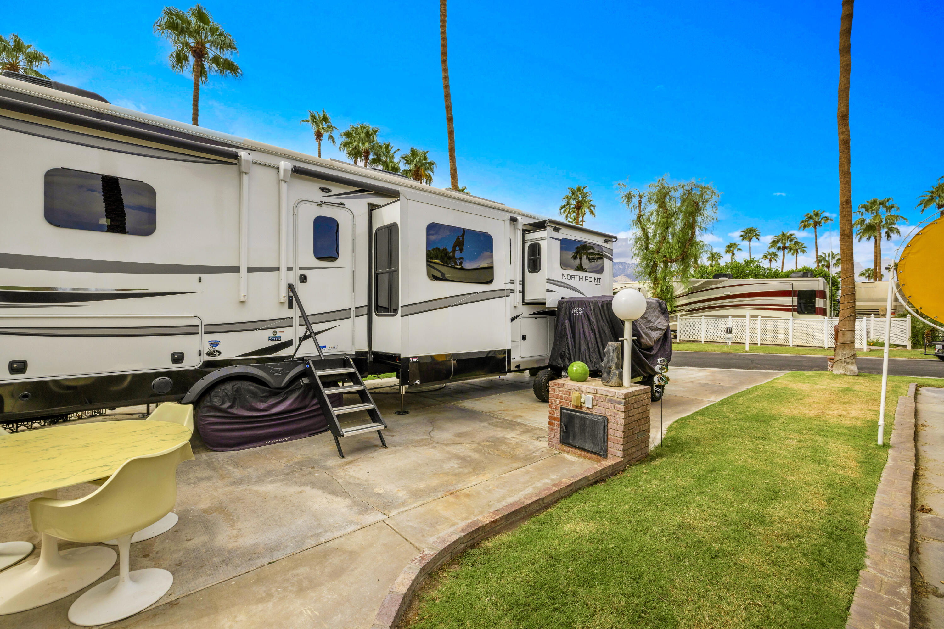 69411 Ramon Road, Unit 8 Cathedral City, CA 92234 - Photo 7 of 14 a view of backyard with outdoor seating and plants
