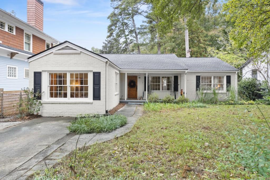 516 Drexel Avenue Decatur, GA 30030 - Photo 1 of 1 a front view of a house with a yard and potted plants