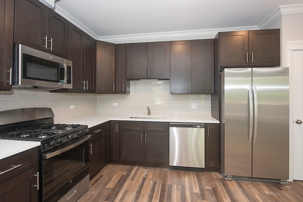 4117 South Michigan Avenue, Unit 2N Chicago, IL 60653 - Photo 5 of 20 a kitchen with a refrigerator stove and microwave