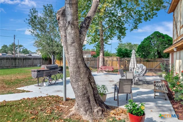 a view of a table and chairs in the patio