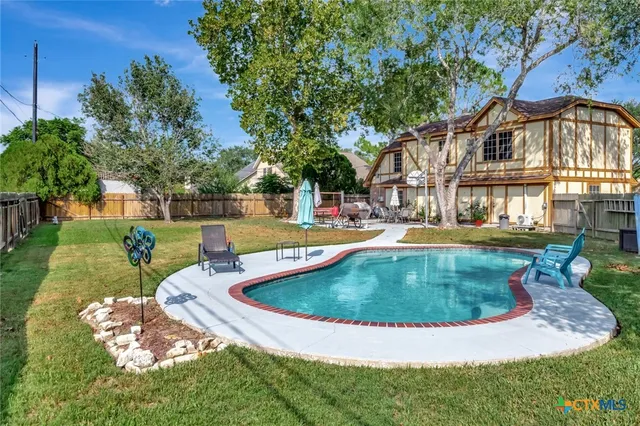 a view of a house with swimming pool