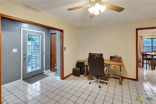a view of workspace with lounge chair
