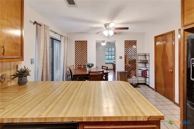 a bed room with a bed and a large mirror