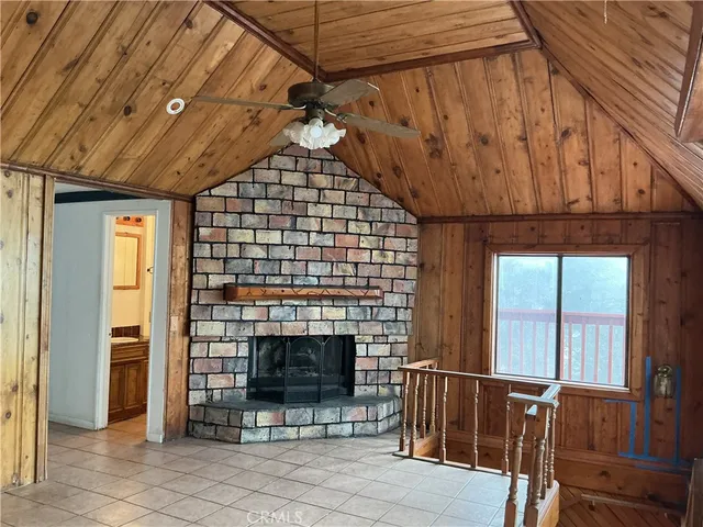 a bedroom with furniture and a fireplace
