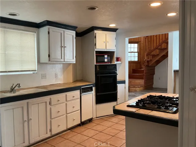 a bathroom with a sink toilet and mirror