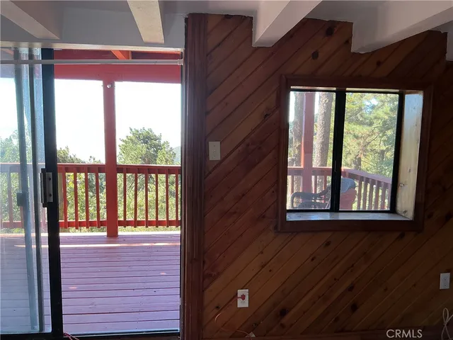 a view of balcony with wooden floor