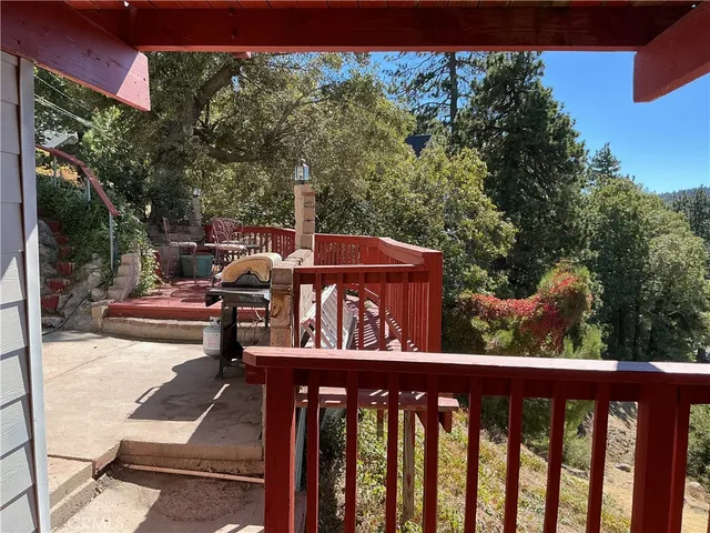 a view of a forest from a balcony