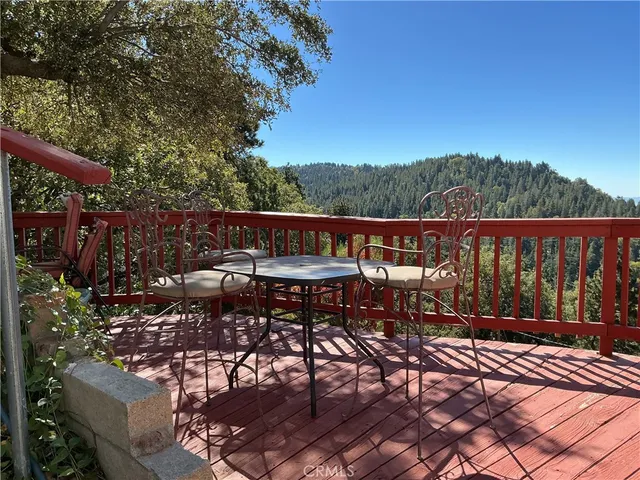 a view of a balcony with trees