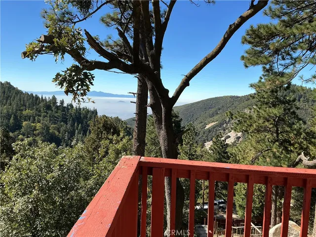 a view of a wooden deck and a yard