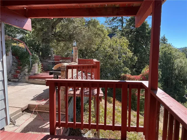 a view of a chairs and table in the balcony