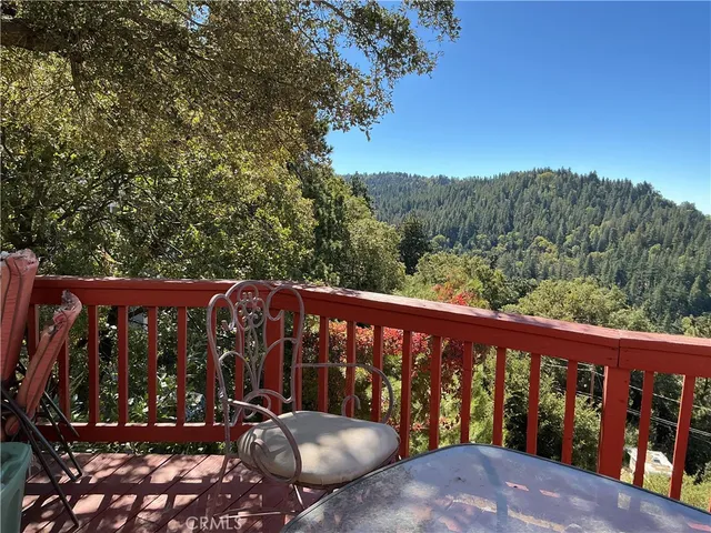 a view of a balcony with wooden floor