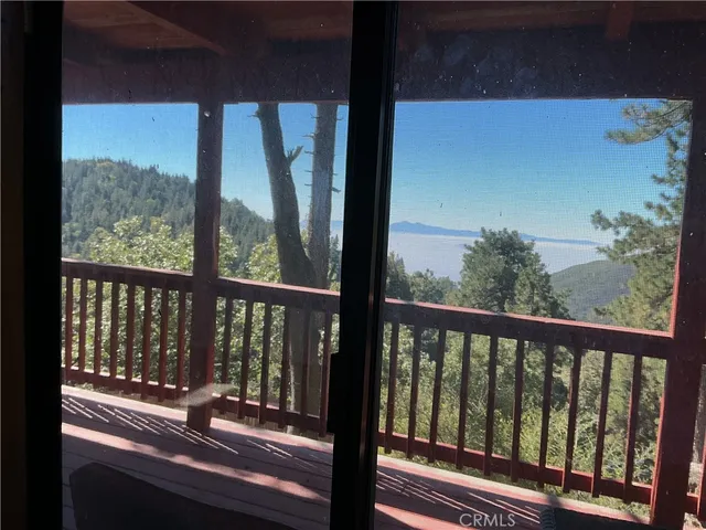 a view of a roof deck with wooden fence