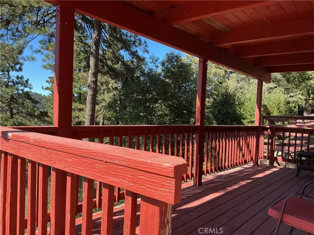 a view of a roof deck with wooden floor