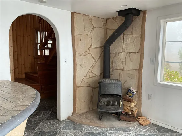 a view of a livingroom with furniture and staircase