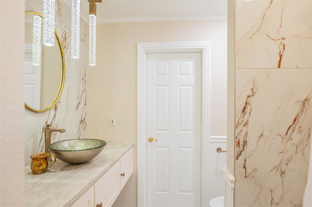 741 Brookside Road Maitland, FL 32751 - Photo 19 of 43 a view of a bathroom with a sink and mirror