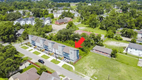 an aerial view of residential house with outdoor space and street view