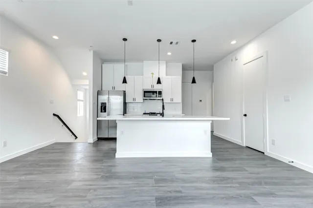 a white refrigerator freezer sitting inside of a kitchen