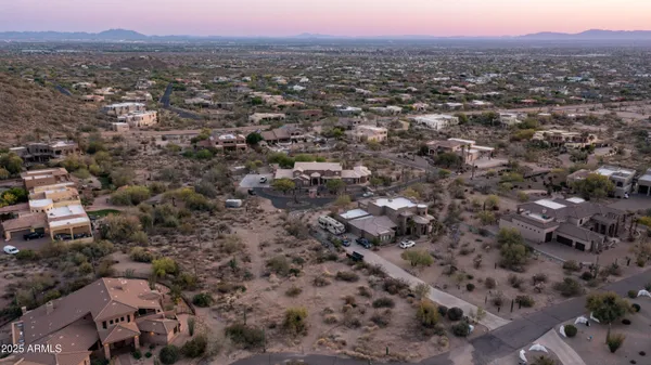 an aerial view of a house with a city view
