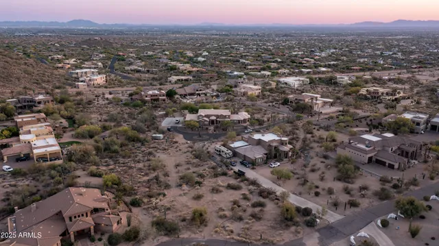 an aerial view of a house with a city view