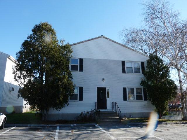 310 Mitchell Street, Unit G2 Groton, CT 06340 - Photo 1 of 1 a front view of a house with garden