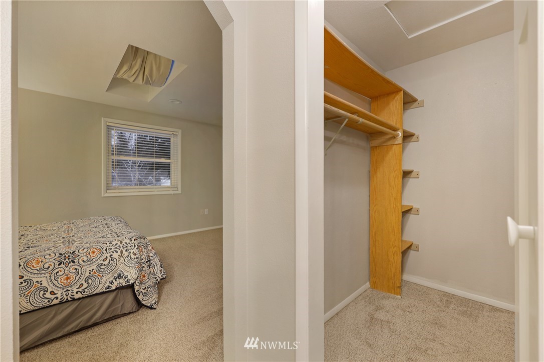 2702 Allen Road Southeast Olympia, WA 98501 - Photo 21 of 37 a bedroom with a bed and a painting on the wall