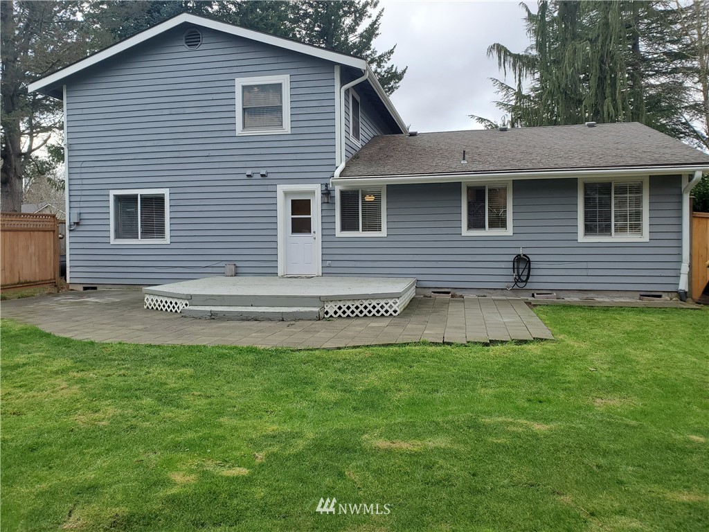 2702 Allen Road Southeast Olympia, WA 98501 - Photo 27 of 37 a front view of a house with a garden