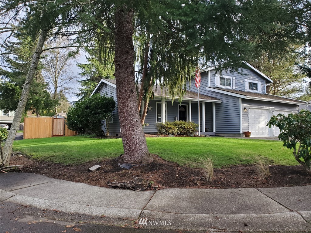 2702 Allen Road Southeast Olympia, WA 98501 - Photo 34 of 37 a front view of a house with a yard and an trees