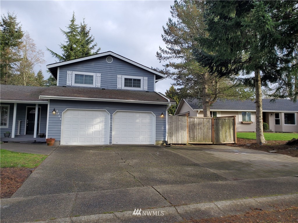 2702 Allen Road Southeast Olympia, WA 98501 - Photo 35 of 37 a front view of a house with yard and trees