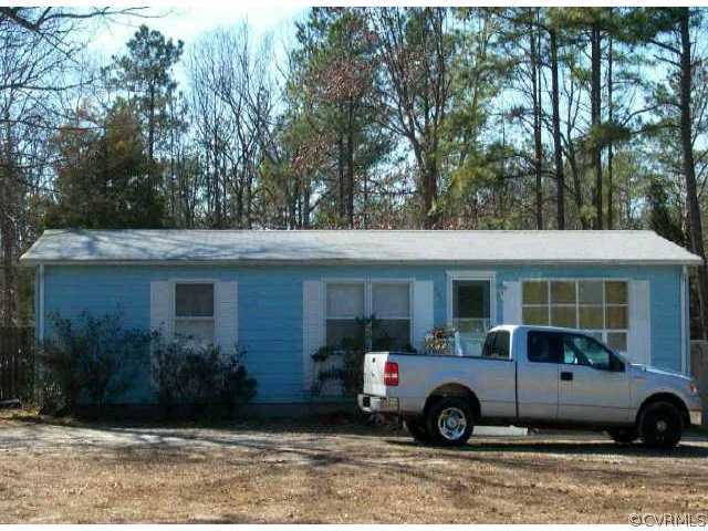 8620 Turnerville Road Midlothian, VA 23112 - Photo 1 of 1 a car parked in front of a house