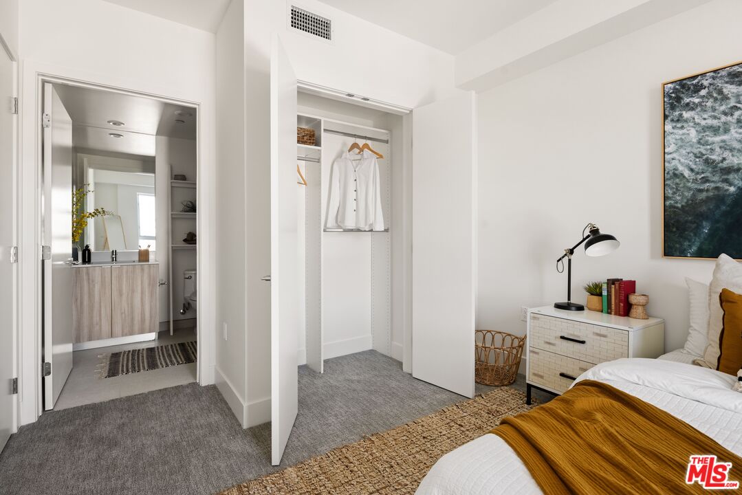 2600 South Sepulveda Boulevard, Unit 305 Los Angeles, CA 90064 - Photo 11 of 33 a bedroom with bed and walk in closet
