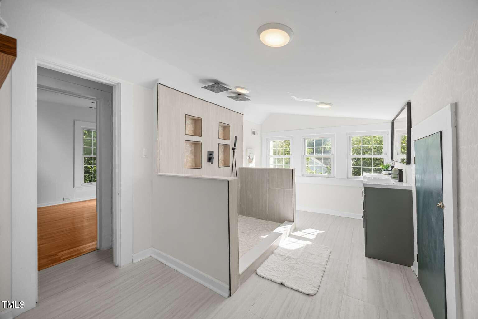 523 East Main Street Haw River, NC 27258 - Photo 14 of 25 a view of a kitchen with refrigerator and wooden floor