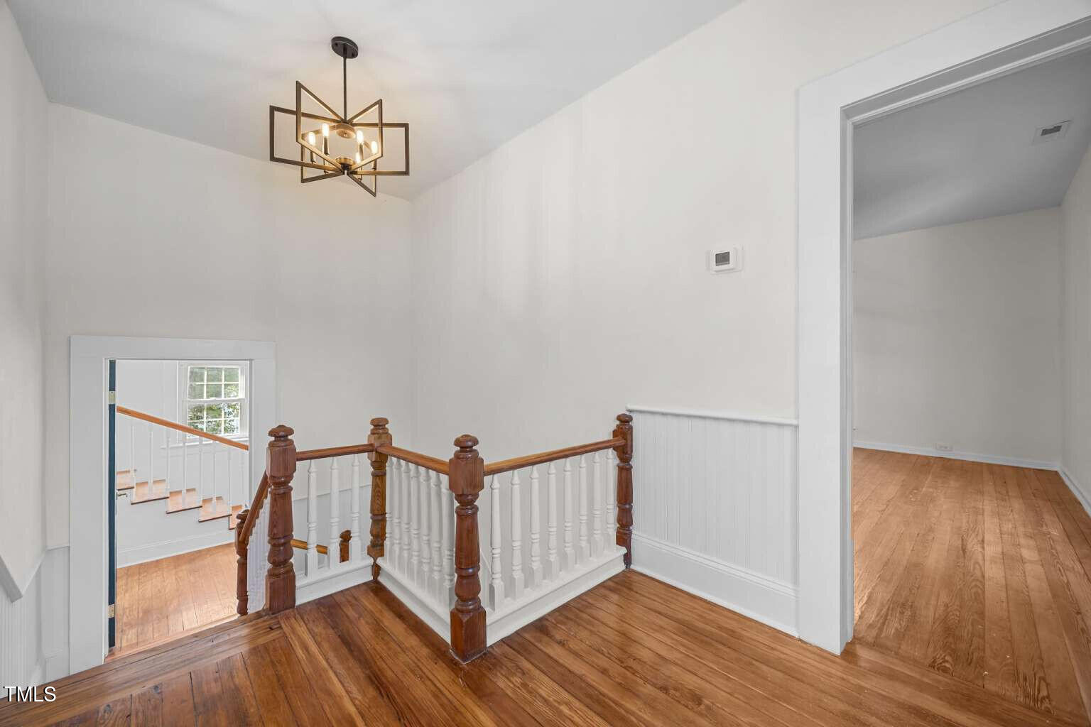 523 East Main Street Haw River, NC 27258 - Photo 18 of 25 a view of a hallway with wooden floor and staircase