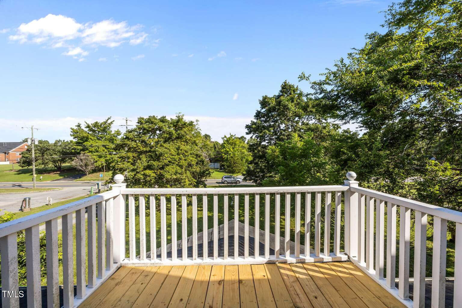 523 East Main Street Haw River, NC 27258 - Photo 19 of 25 a view of balcony with wooden floor and fence