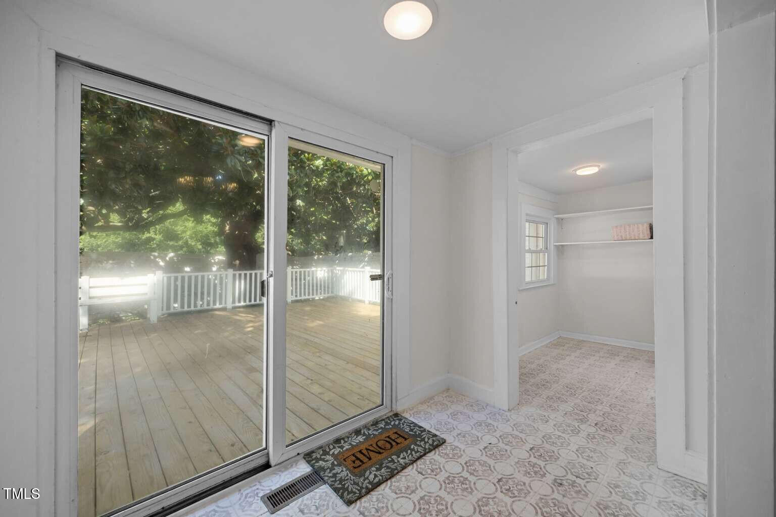 523 East Main Street Haw River, NC 27258 - Photo 9 of 25 a view of entryway with a floor to ceiling window and wooden floor