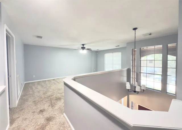 a view of pool and windows