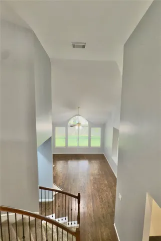 a view of a hallway with a window