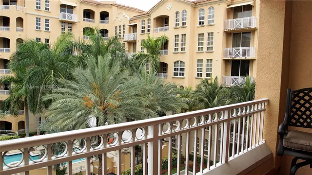 a view of a balcony with chairs