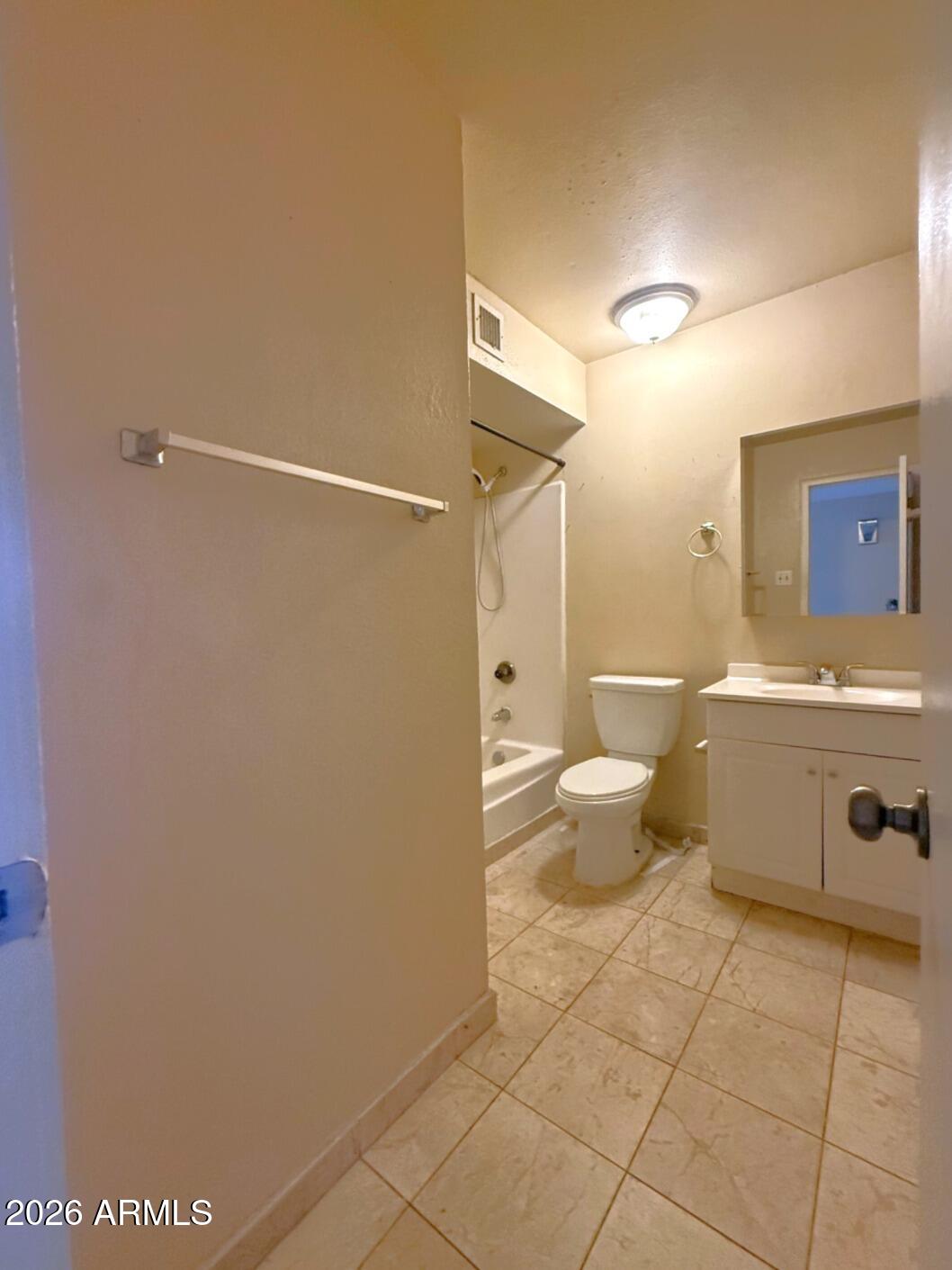 4625 South Rita Lane Tempe, AZ 85282 - Photo 12 of 16 a bathroom with a sink a toilet and a shower