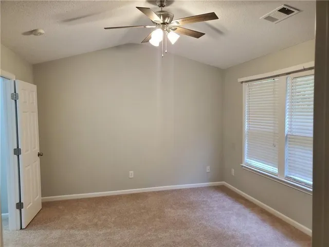a bathroom with a sink toilet a mirror and shower