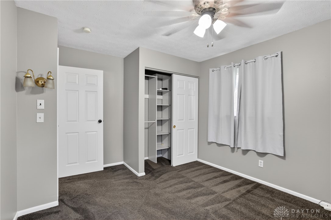 5741 Gray Road Fairfield, OH 45014 - Photo 21 of 32 This cozy bedroom features a practical closet with built-in shelving, perfect for organized living.