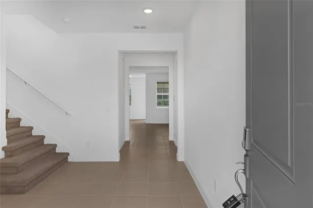 a view of a hallway with staircase