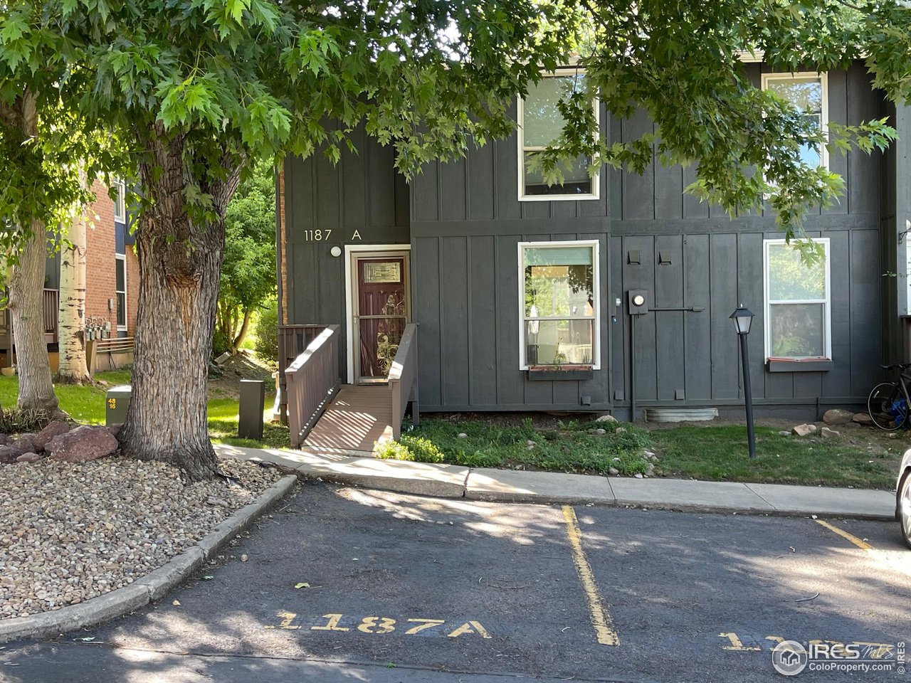 1187 Bear Mountain Drive, Unit A Boulder, CO 80305 - Photo 1 of 26 a front view of a house with garden